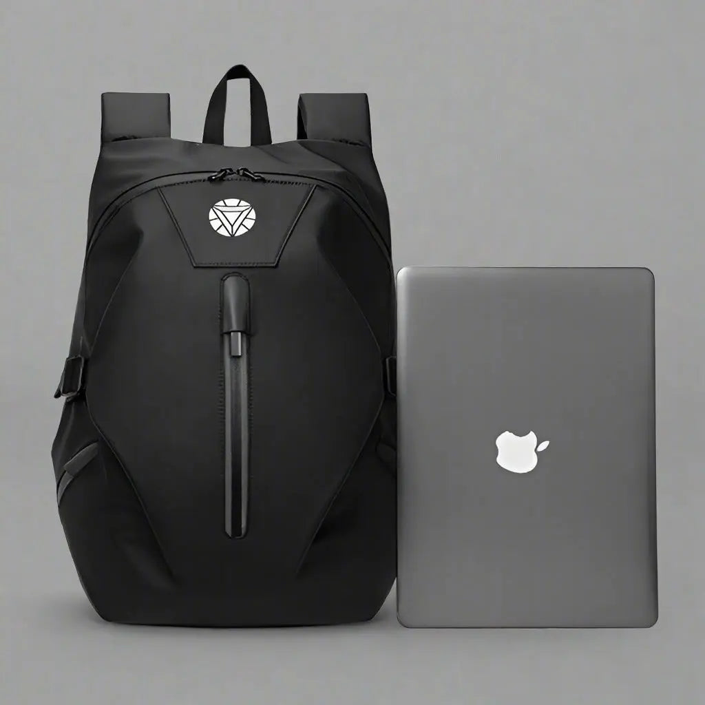 Sac à dos 2 roues Noir, posé à côté d'un ordinateur portable