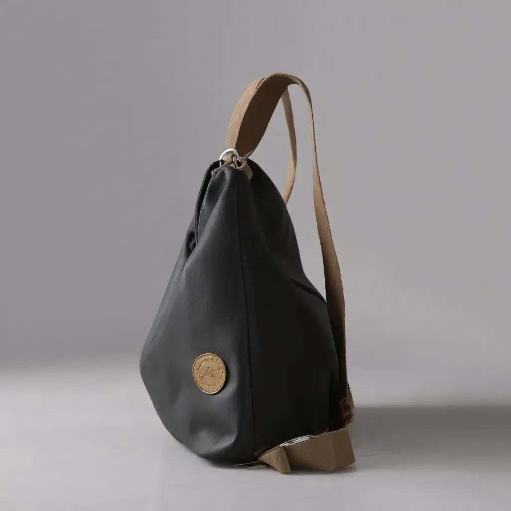 Sac à dos bandoulière femme voyage Noir vue de côté