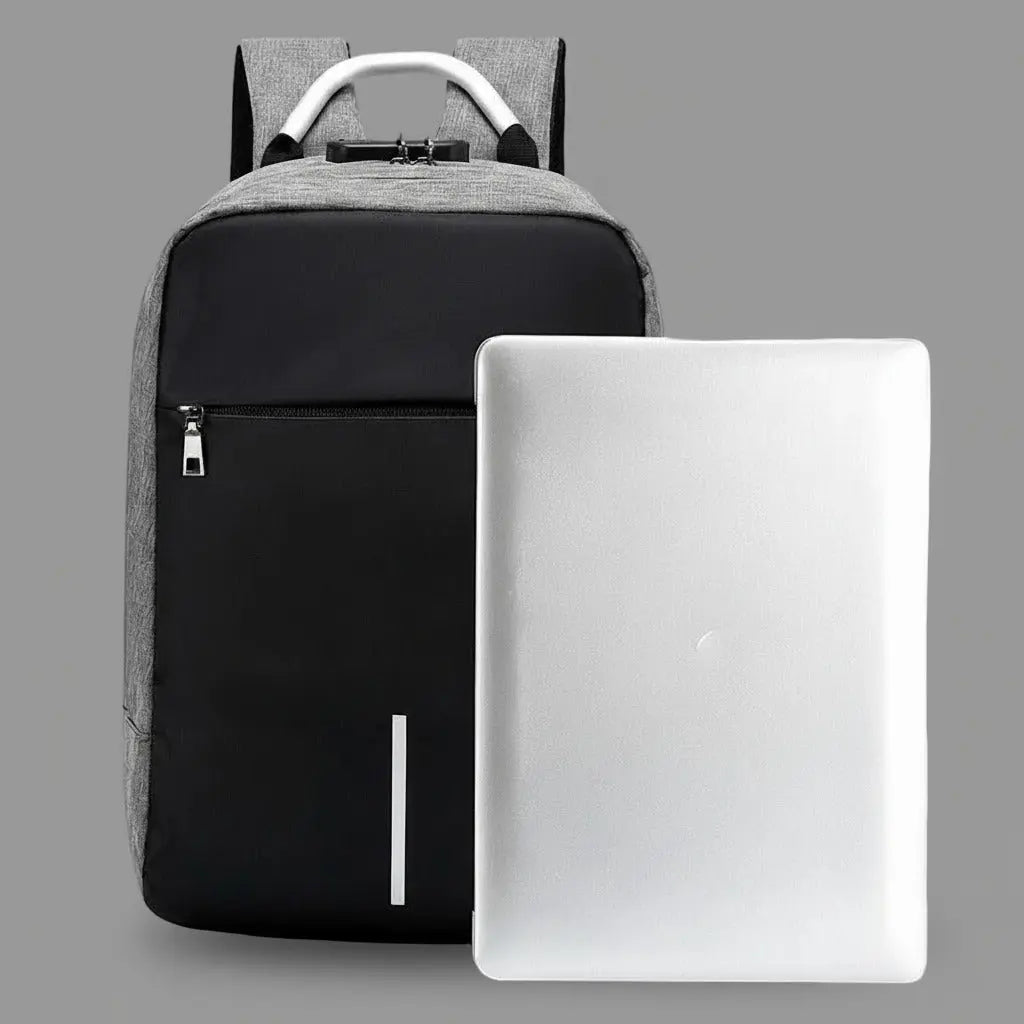 Sac à dos ordinateur avec charge USB Gris présenté à côté d'un ordinateur portable